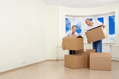 Packed moving boxes and furniture prepared for a local Finchley relocation