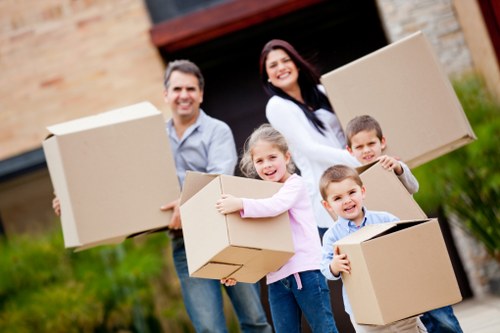Careful loading of wrapped furniture into a removals van
