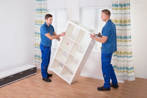 Packing and loading furniture during a business move in Finchley