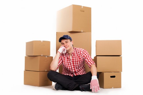Packed moving boxes and a van ready for a student relocation in Finchley